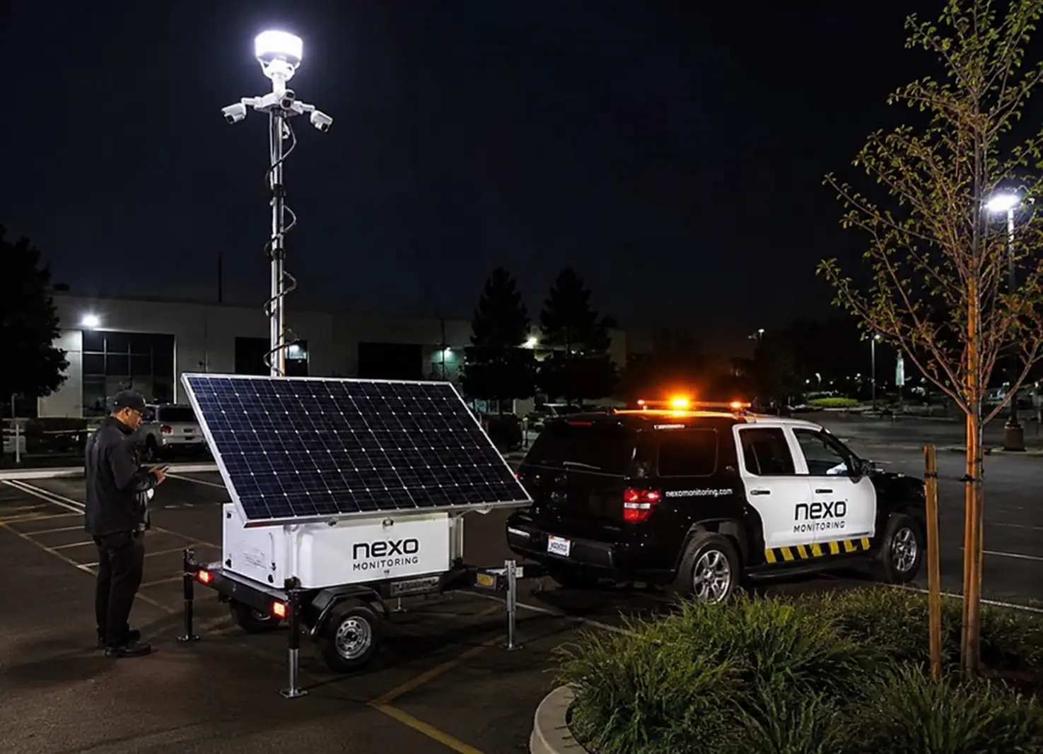 A Nexo Monitoring patrol vehicle parked downtown at night